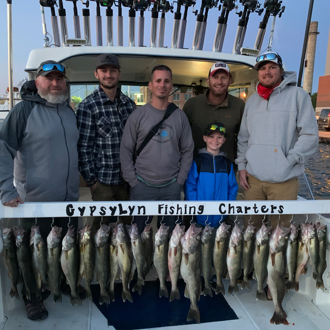 family with walleye catch