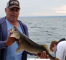 older gentleman surprised by the size of his walleye